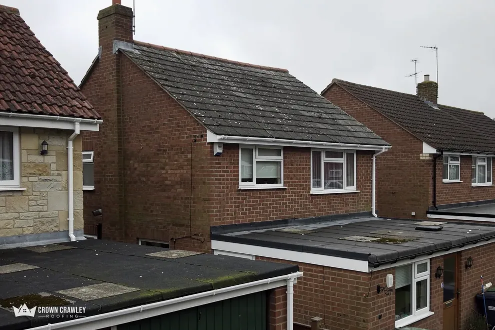 Flat roof extension on a brick-built house with a garage