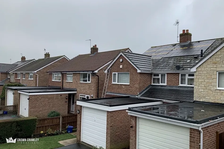 Flat-roofed garages at the back of semi-detached houses