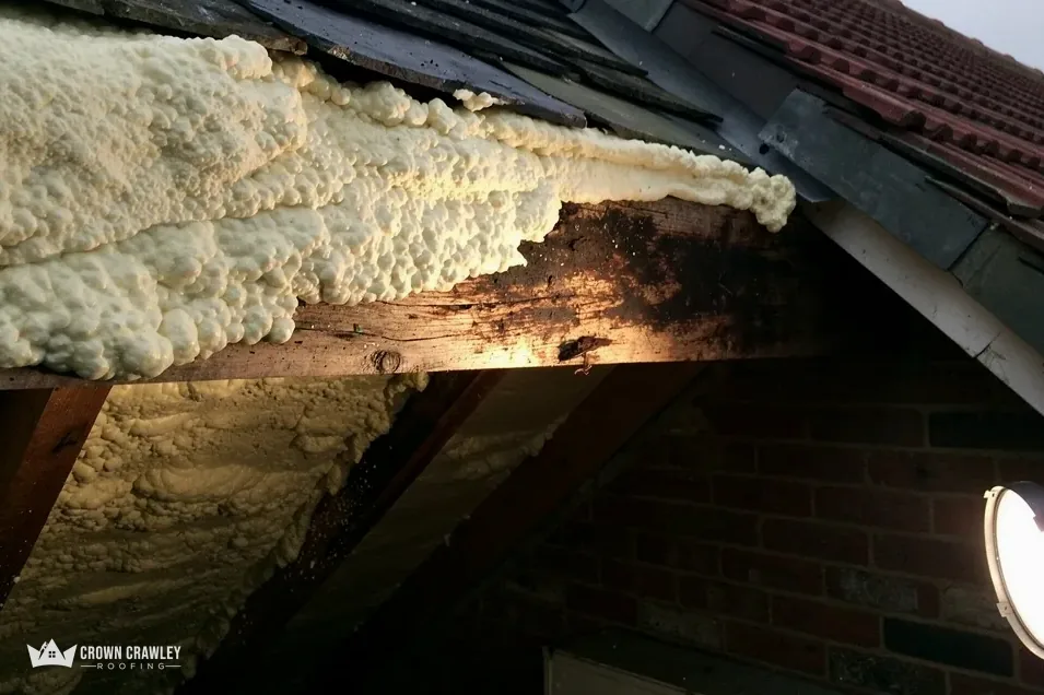 Spray foam insulation applied between the rafters of a roof