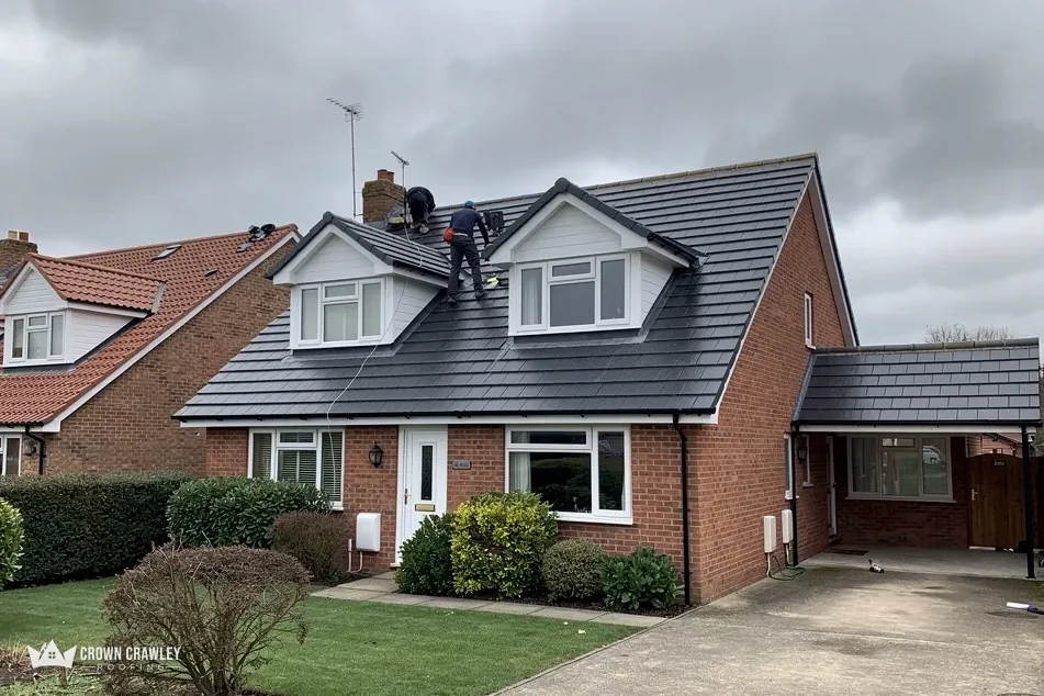 Dormer bungalow with a new dark tiled roof