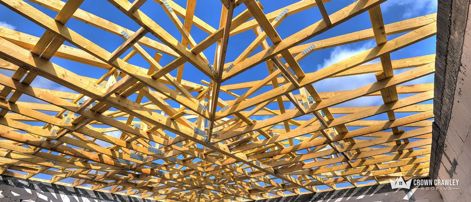 Timber roof trusses open to the sky