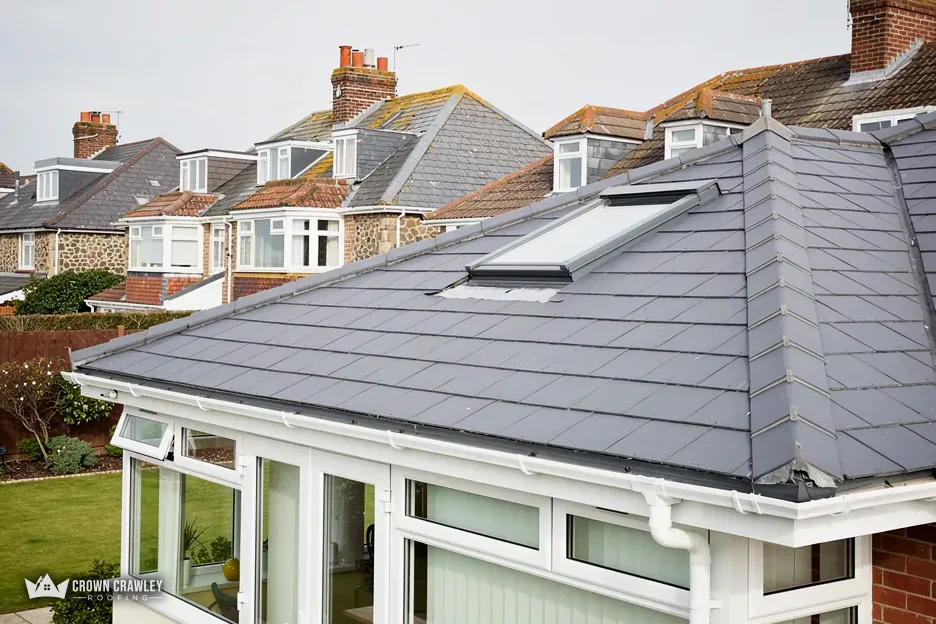 Slate-effect roof over a conservatory on a suburban house
