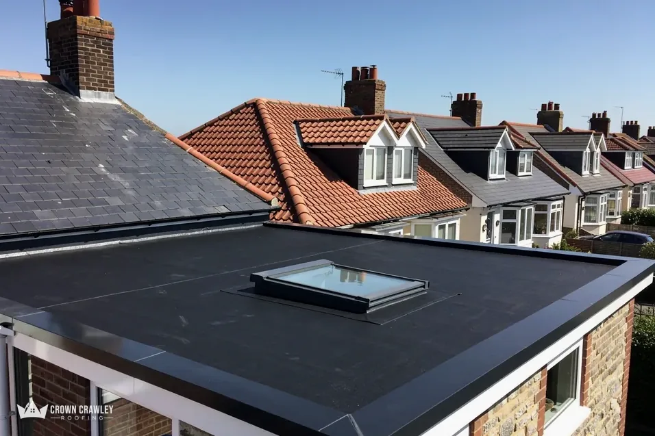 Black flat roof with a rooflight on a house extension